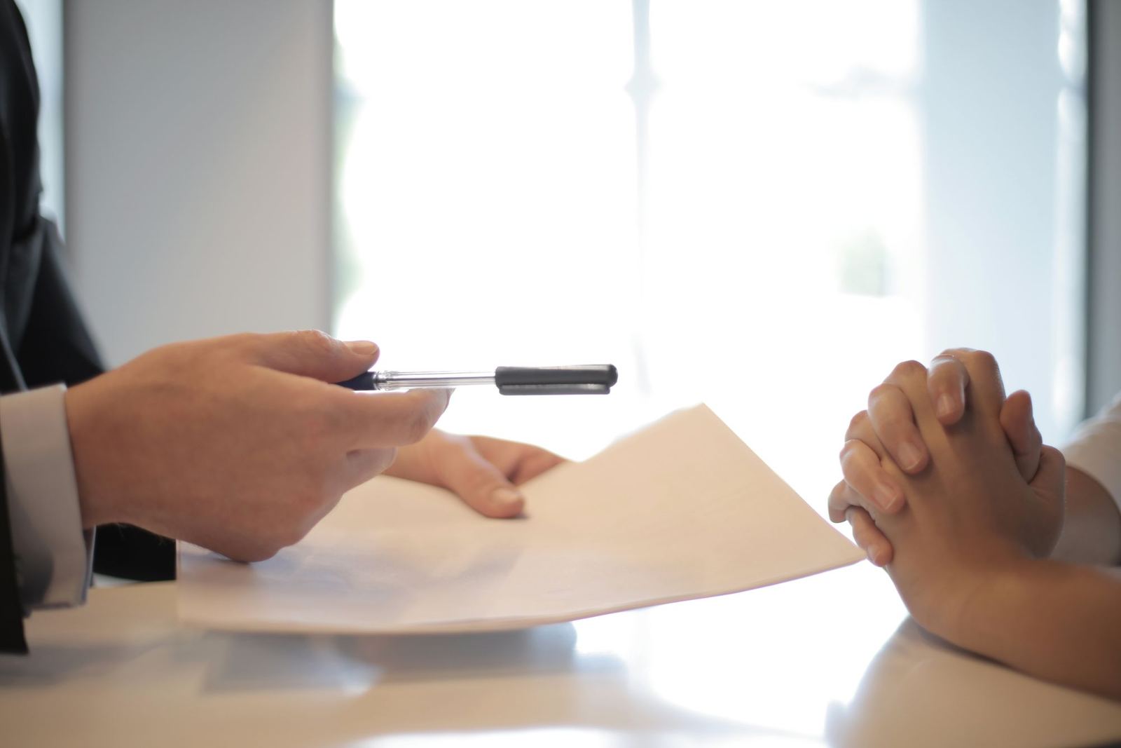 Two people reviewing a business document together at a table